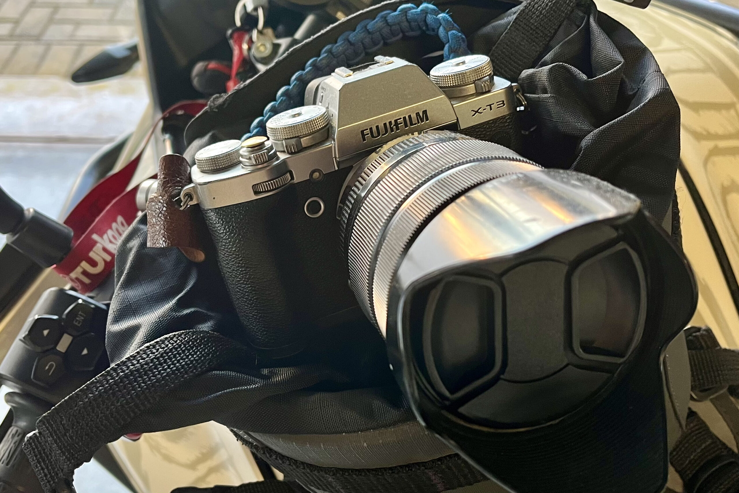 Fujifilm X-T3 with 18-135mm lens carried in a motorcycle tank bag while travelling